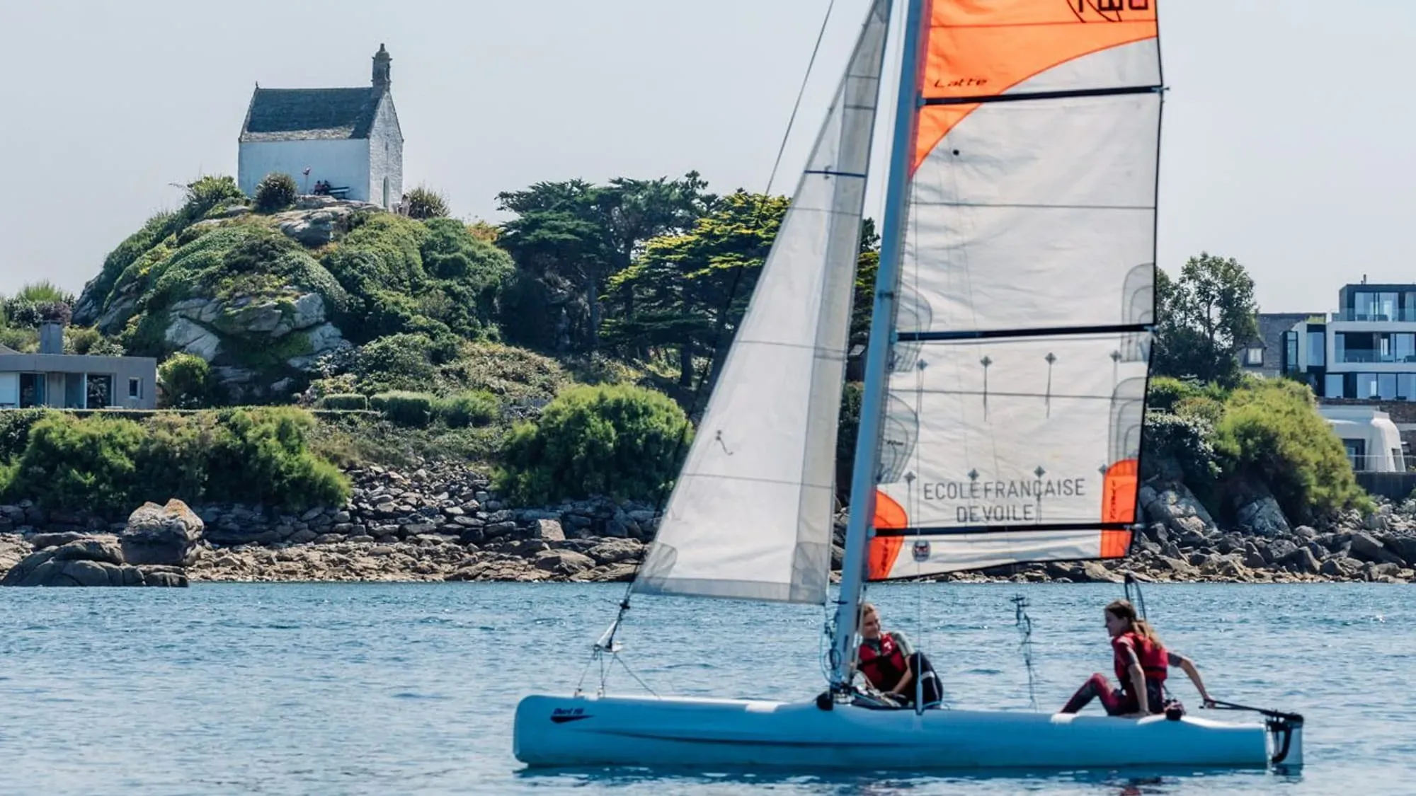 Sailor on a catamaran with an instructor